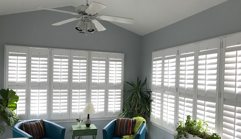 Miami sunroom with fan and shutters